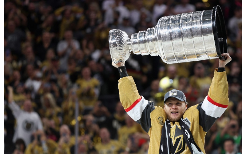 Golden Knights players celebrate with the Stanley Cup trophy