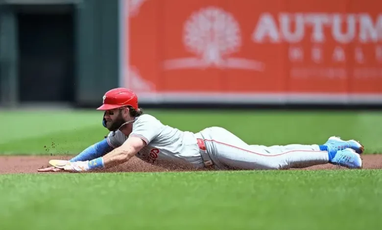 Bryce Harper #3 of the Philadelphia Phillies slides into second base for a stolen base in the first inning against the Baltimore Orioles at Oriole Park at Camden Yards on June 16, 2024 in Baltimore, Maryland