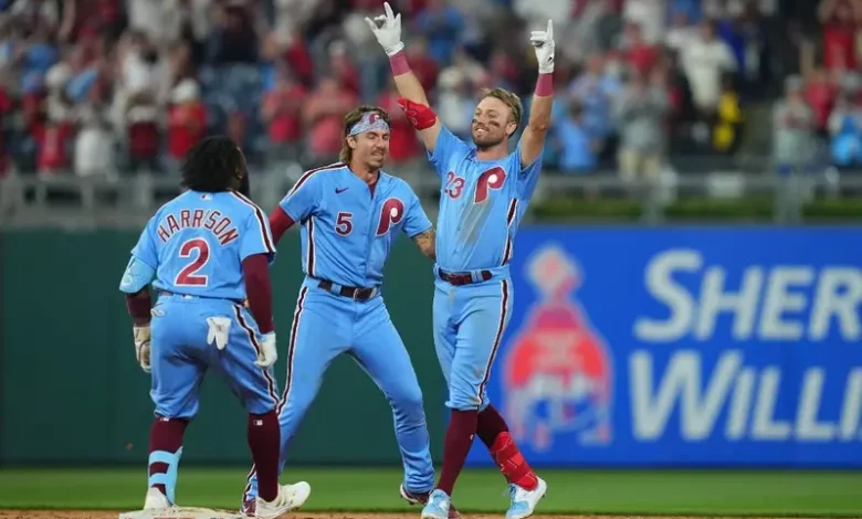 Kody Clemens #23 of the Philadelphia Phillies celebrates with Bryson Stott #5 and Josh Harrison #2 after hitting a walk-off single in the bottom of the ninth inning against the Detroit Tigers at Citizens Bank Park on June 8, 2023 in Philadelphia, Pennsylvania. The Phillies defeated the Tigers 3-2.